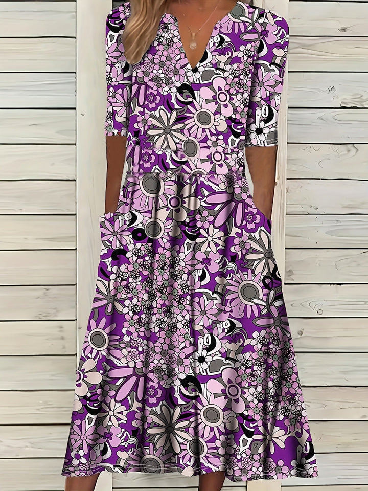 Odette | Robe midi à imprimé floral, décolleté en V et ourlet asymétrique