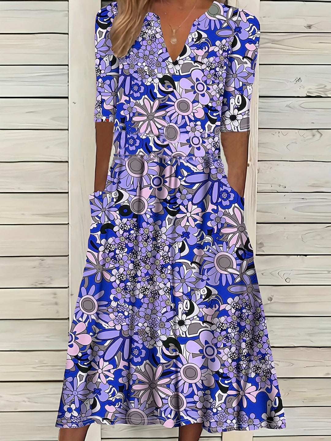 Odette | Robe midi à imprimé floral, décolleté en V et ourlet asymétrique